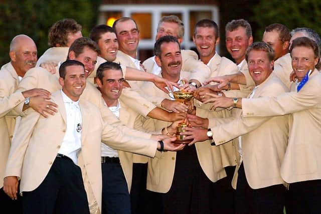 European team captain Sam Torrance celebrates with his players after the 2002 Ryder Cup win at The Belfry. Picture: Adrian Dennis/AFP via Getty Images.