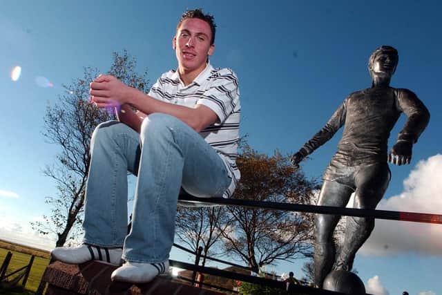A teenage Scott Brown, pictured beside the statue of Jim Baxter in his home village of Hill of Beath, for an interview with The Scotsman shortly after making his Hibs debut in 2003. Pic: Phil Wilkinson