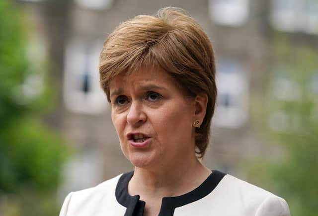 First Minister Nicola Sturgeon has said the pandemic could continue to put ‘huge pressure’ on the NHS after Scotland recorded the highest ever daily total of new cases and the most deaths since April (Photo: Andrew Milligan/ PA Wire).