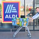 James Taylor of Taylors Snacks outside an Aldi store with his company's crisps. Picture: Julie Howden