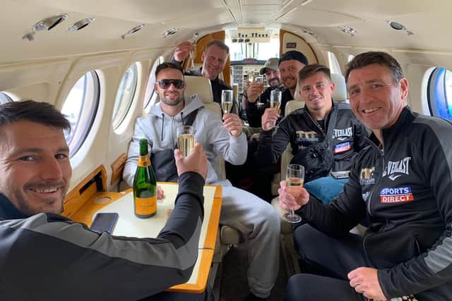Lee McGregor enjoys a glass of bubbly alongside Josh Taylor as they return to Scotland on a private jet. Picture: MTK Global Boxing