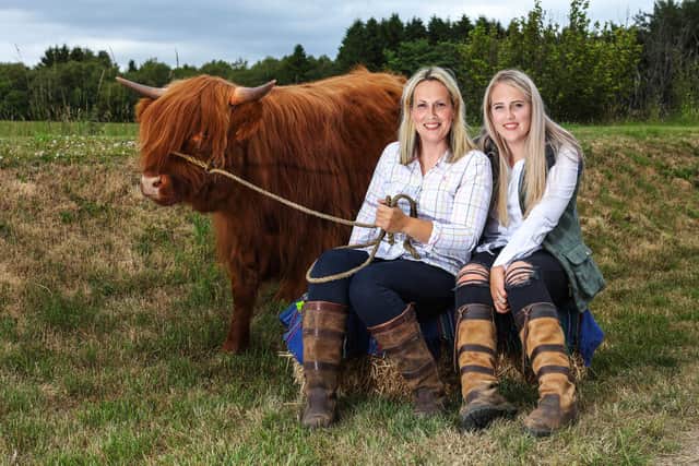 Grace and her daughter Beth, who is studying agriculture, with on of their herd of 140 Highland cows at her farm in Aberdeenshire.