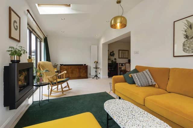 Large Velux windows afford the home’s stylish living room lots of natural light