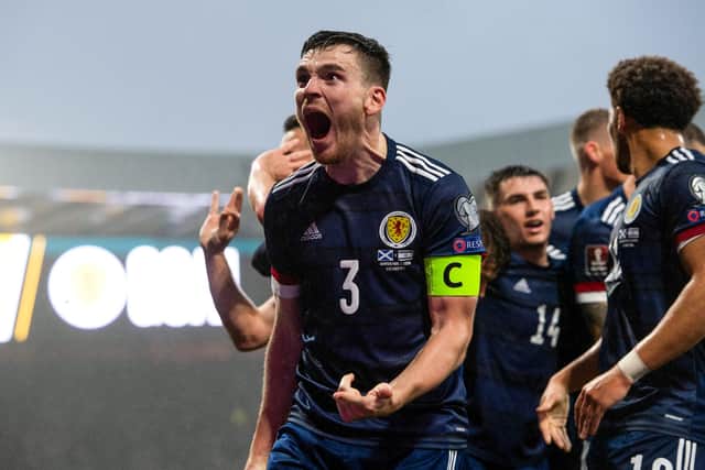 Scotland captain Andrew Robertson celebrates John McGinn's equaliser against Israel. (Photo by Sammy Turner / SNS Group)