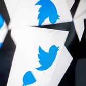 The Twitter logo reflected near the logo for Threads, an Instagram app. Picture: Stefani Reynolds/AFP via Getty Images