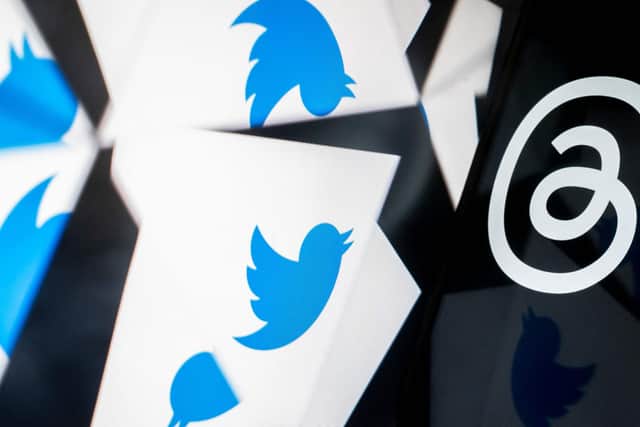 The Twitter logo reflected near the logo for Threads, an Instagram app. Picture: Stefani Reynolds/AFP via Getty Images