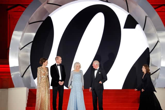 Britain's Catherine, Duchess of Cambridge (left), Britain's Prince William, Duke of Cambridge (second from left), Britain's Camilla, Duchess of Cornwall (second from right) and Britain's Prince Charles, Prince of Wales pose with US-British film producer Barbara Broccoli (right) on the red carpet. Picture: Tolga Akmen/AFP via Getty Images