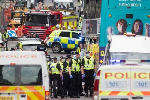 Officers at the scene in Glasgow.