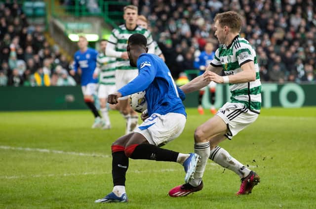 Rangers claim for a penalty after the ball hits the arm of Celtic's Alistair Johnston. (Photo by Craig Williamson / SNS Group)