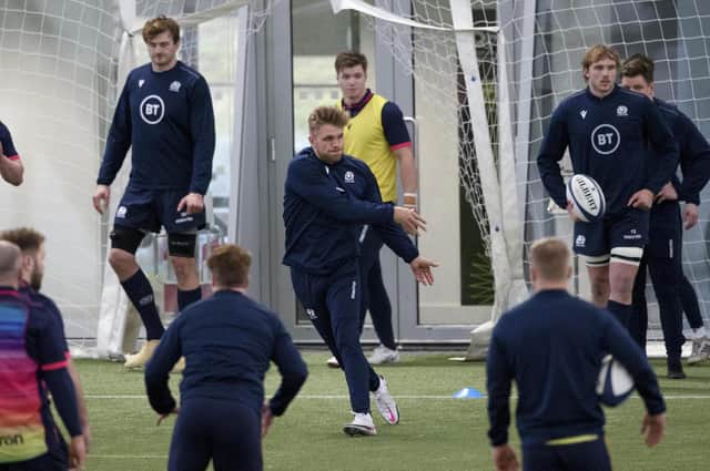 Chris Harris is at the centre of the action during a Scotland training session at the Oriam. Picture: Craig Williamson/SNS
