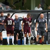 The Hearts coaching trio look to get their message across to the team during the pre-season friendly with Dunfermline Athletic.  (Photo by Ross Parker / SNS Group)