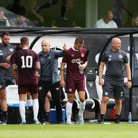 The Hearts coaching trio look to get their message across to the team during the pre-season friendly with Dunfermline Athletic.  (Photo by Ross Parker / SNS Group)