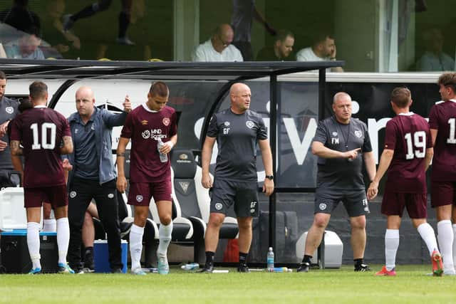 The Hearts coaching trio look to get their message across to the team during the pre-season friendly with Dunfermline Athletic.  (Photo by Ross Parker / SNS Group)