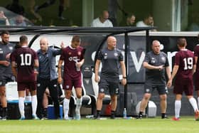 The Hearts coaching trio look to get their message across to the team during the pre-season friendly with Dunfermline Athletic.  (Photo by Ross Parker / SNS Group)
