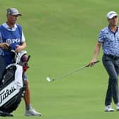 Justin Thomas and his caddie Jim "Bones" Mackay weigh up a shot on the 18th hole during the second round of the 2022 PGA Championship at Southern Hills Country Club in Tulsa, Oklahoma. Picture: Richard Heathcote/Getty Images.
