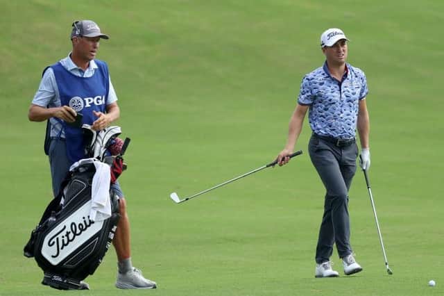 Justin Thomas and his caddie Jim "Bones" Mackay weigh up a shot on the 18th hole during the second round of the 2022 PGA Championship at Southern Hills Country Club in Tulsa, Oklahoma. Picture: Richard Heathcote/Getty Images.