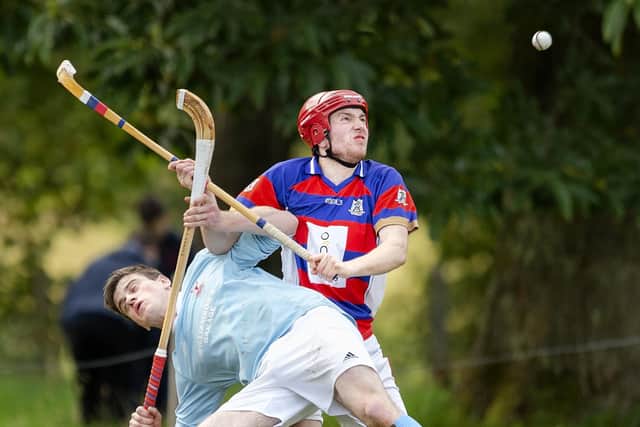 Kingussie’s Calum Grant gets the better of Craig Morrison (Caberfeidh). Caberfeidh v Kingussie in the Mowi Premiership, played at Castle Lead, Strathpeffer.