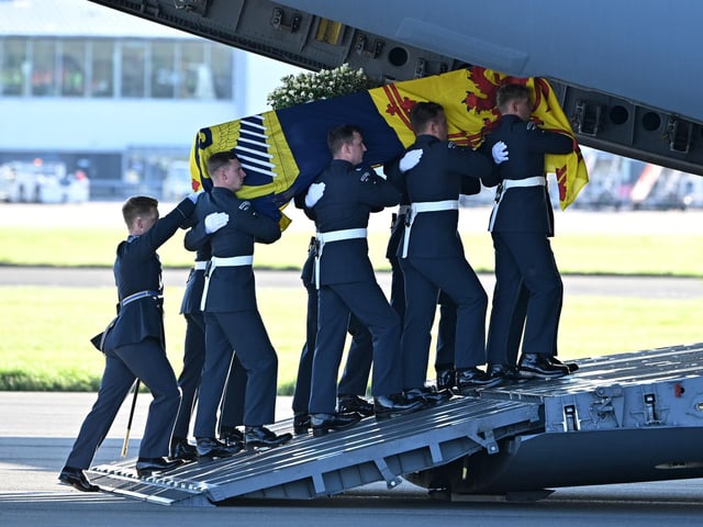 A bearer party from Queen's Colour Squadron of the Royal Air Force (RAF) carry the coffin of Queen Elizabeth II aboard an RAF RAF C17 aircraft on its journey from Edinburgh to Buckingham Palace, London, where it will lie at rest.