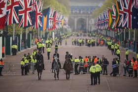 Mounted officers from the Metropolitan Police arrive on The Mall in London ahead of the coronation ceremony of King Charles III and Queen Camilla. Picture,  Niall Carson/PA Wire