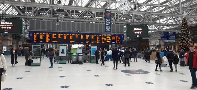 Rail passengers such as at Glasgow Central Station - Scotland's busiest - face significant disruption until at least January 7. Picture: The Scotsman