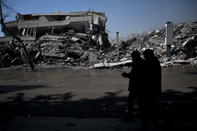 Turkish police officers patrol carry out search operations among the rubble of collapsed buildings in Kahramanmaras on February 12, 2023, after a 7.8-magnitude earthquake struck the country's southeast earlier in the week. Photo by OZAN KOSE/AFP via Getty Images