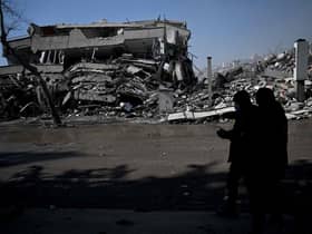 Turkish police officers patrol carry out search operations among the rubble of collapsed buildings in Kahramanmaras on February 12, 2023, after a 7.8-magnitude earthquake struck the country's southeast earlier in the week. Photo by OZAN KOSE/AFP via Getty Images