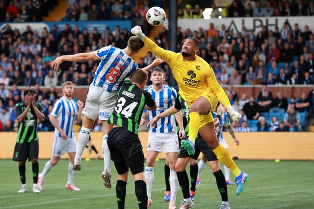 Cercle Brugge goalkeeper Warleson makes a save from Kilmarnock's Brad Lyons during the UEFA Europa League second qualifying round, first leg match at Rugby Park, Kilmarnock. PIC: Steve Welsh/PA Wire.