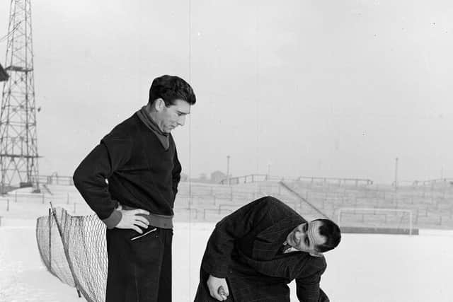 Hibs manager Eddie Turnbull and referee Mr J Bissett inspect the Easter Road pitch in 1960