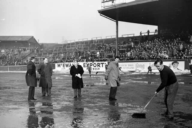 A match between Partick Thistle v Falkirk at Firhill is called off shortly before kick-off because of water logging on the pitch cause by melted snow