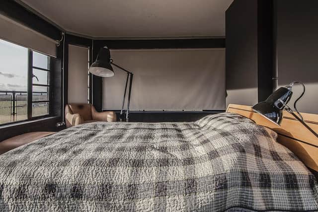 The master bedroom is punctuated with stylish touches and the super kingsize bed serves as an excellent vantage point.