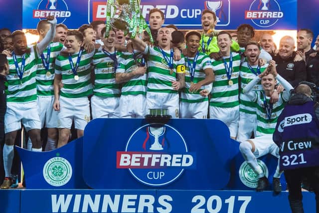 Celtic respond to PSG defeat by picking up their fourth successive trophy.