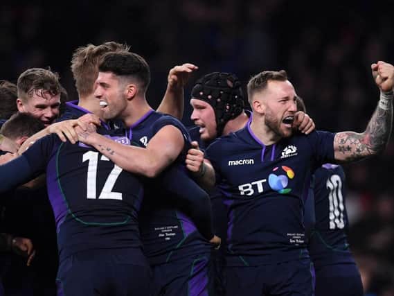 Scotland players celebrate after scoring a try against England at Twickenham