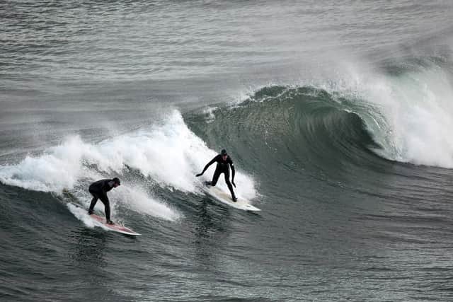 Surfers take to the water all year round at Coldingham Bay (Image: Getty Images)
