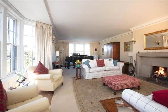The drawing room also offers lovely views and a statement fireplace.