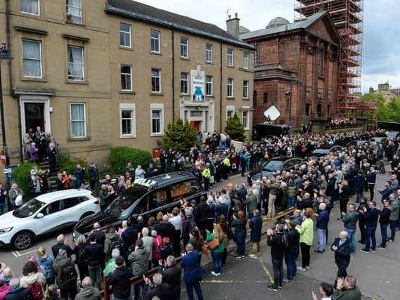 Celtic fans line the street as Billy McNeill's coffin passes