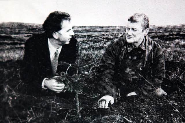 Mr MacDonald and Mr Mackay at the same spot 25 years ago just as the trees were being planted. PIC: Contributed.