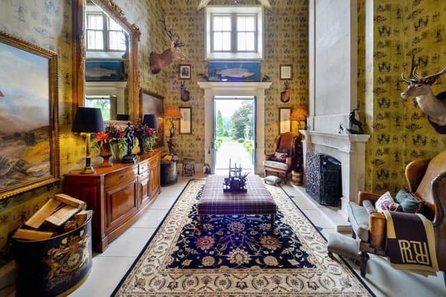 The house has comprehensively refurbished by the current owners as seen in this hunting-lodge style hallway.