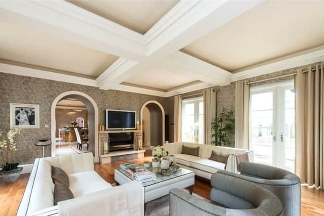 Another living room can be found just off the kitchen.