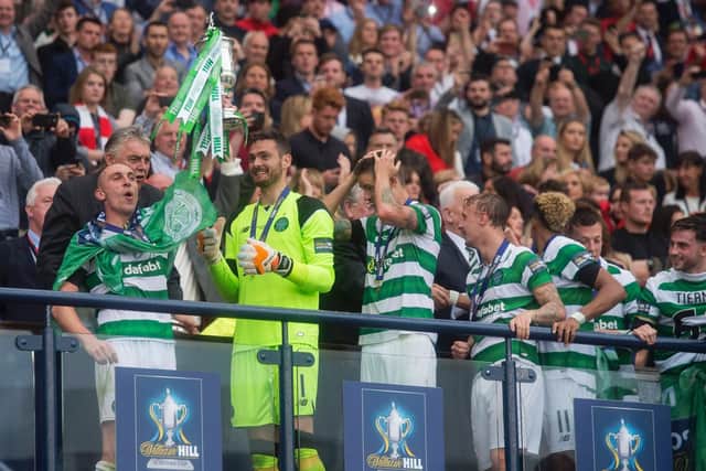 Tom Rogic fired a stoppage-time winner to secure the treble for Celtic.