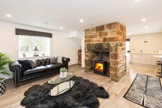 The living room is open plan to the kitchen
