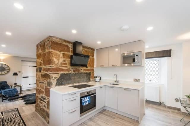 The modern kitchen has integrated appliances.