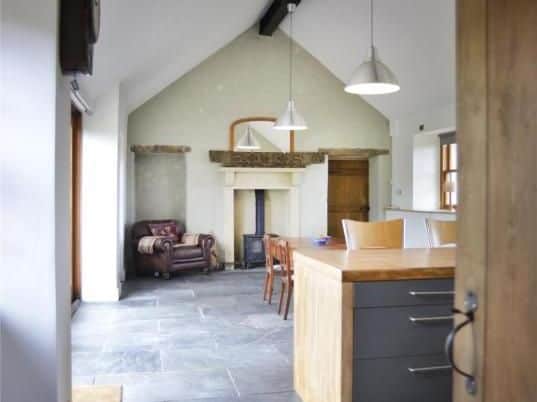 Downstairs there is an open plan kitchen/sitting room.