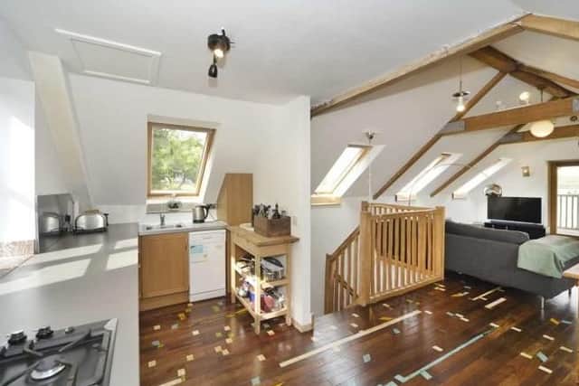 This kitchen area - found in the annex - has reclaimed flooring from a school gym.