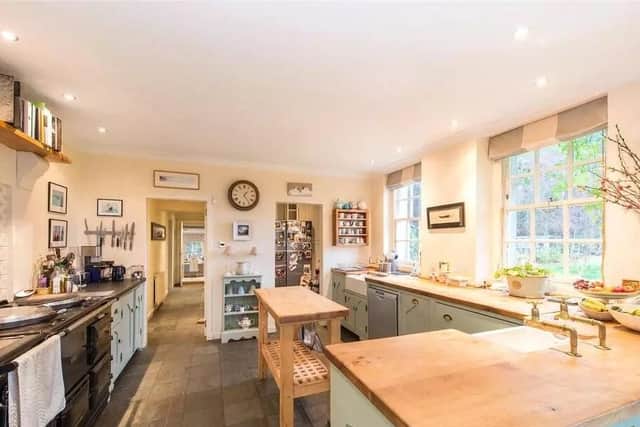 The country style kitchen has a Aga and plenty of storage space.