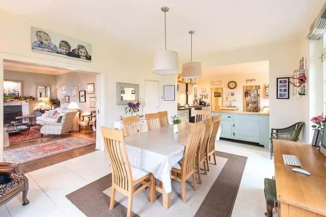 The dining room is located off the family room and near the kitchen.