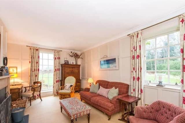 The living room is one of four reception rooms.