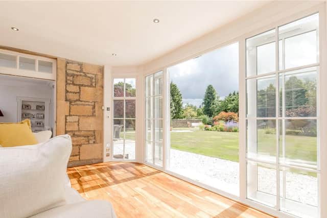 The sun room opens out to the garden and is ideal for summer days.