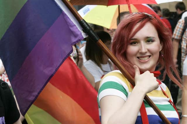 Another participant proudly displays her rainbow flag.