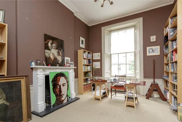 One of the four reception rooms is currently being used as a study.