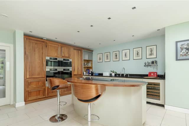 The modern kitchen is spacious and bright.